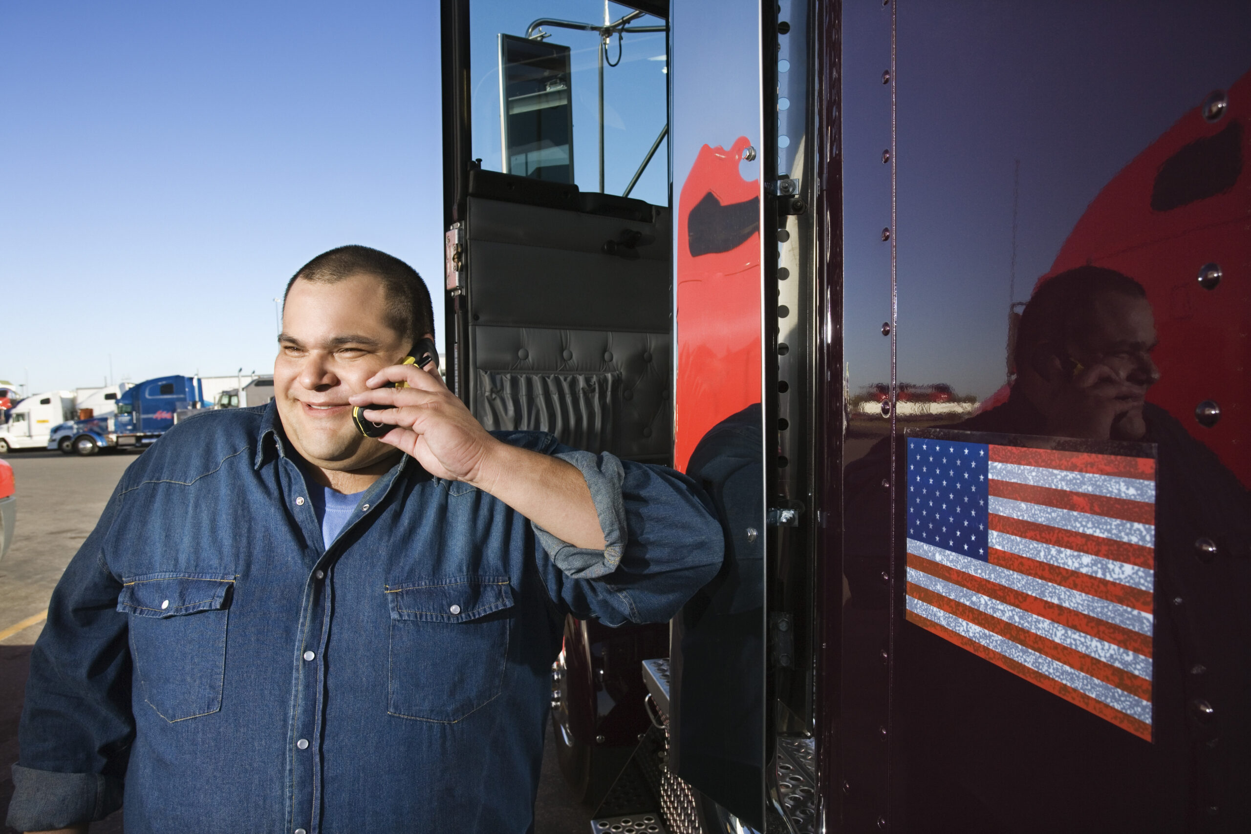 Transportation Worker holding cellphone