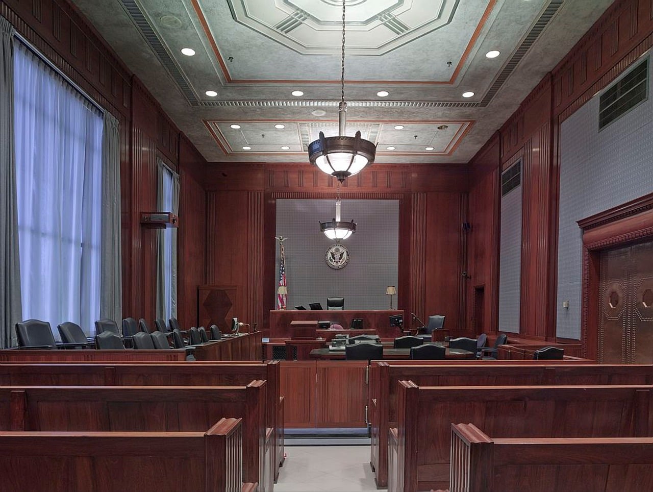 Picture of an empty courtroom with benches